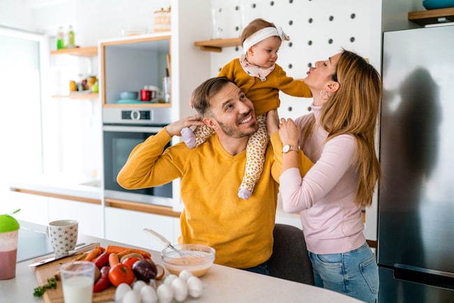 happy-family-preparing-healthy-food-together-in-ki-2021-08-31-09-45-12-utc
